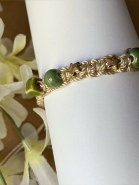 Handcrafted Adjustable Macramé Bracelet with Green Beads and Gold Accents